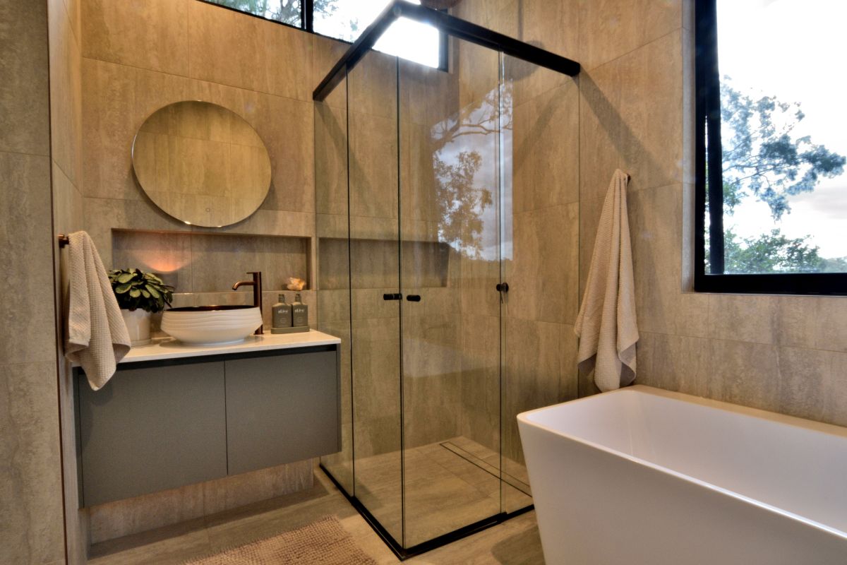 Corner Entry Shower screen with a black frame in a modern Bathroom