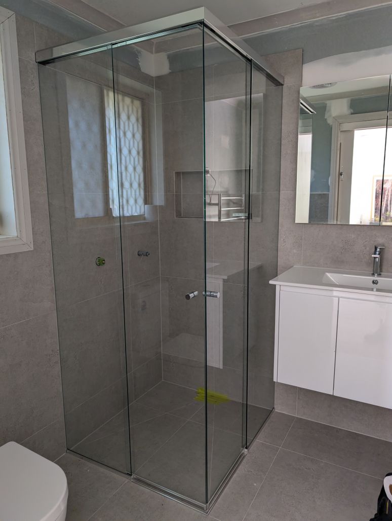 Corner Entry Shower Screen with Polished Silver Frame
