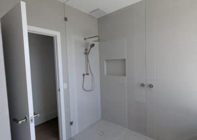 Full height frameless shower screen panel