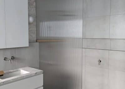 Full height fluted glass shower panel