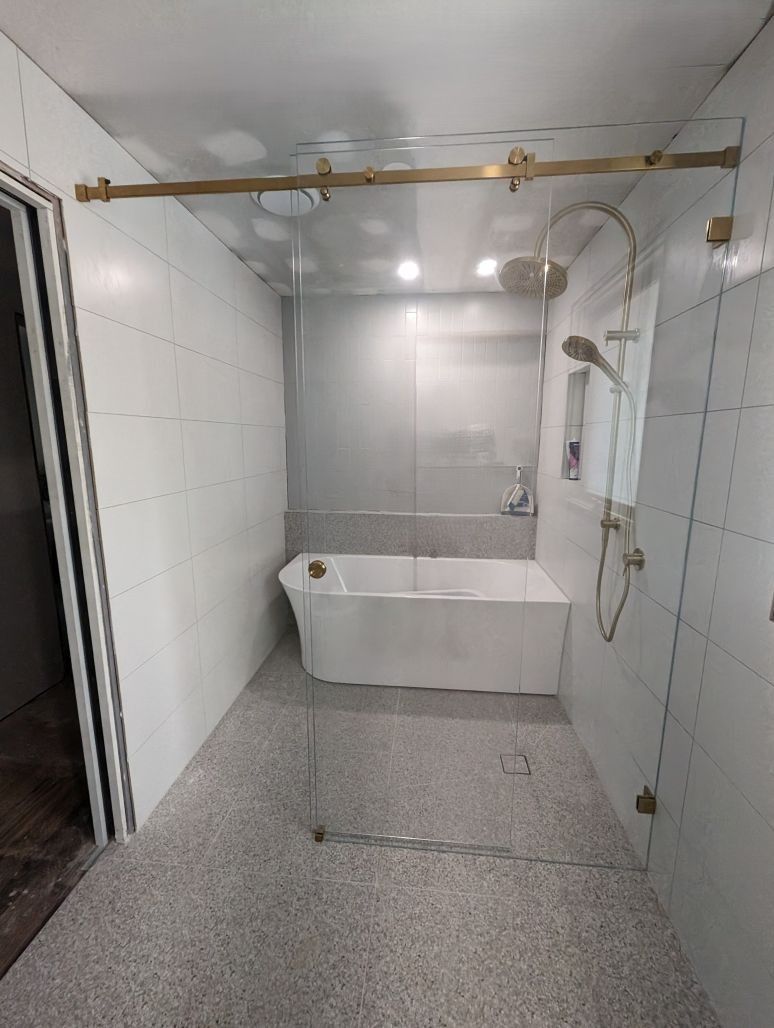 Wall to Wall Sliding shower screen with brushed gold hardware