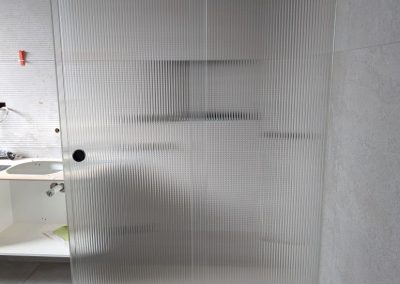 Fluted glass sliding shower screen for bathroom privacy
