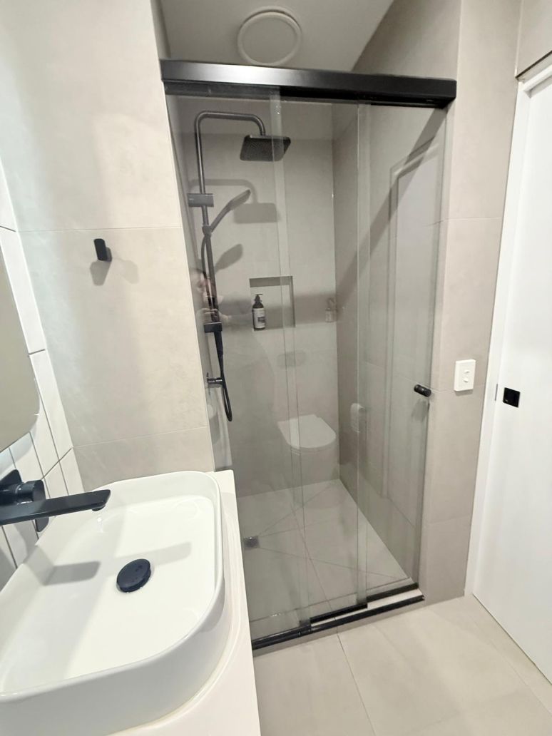 3 Panel sliding shower screen with a black frame