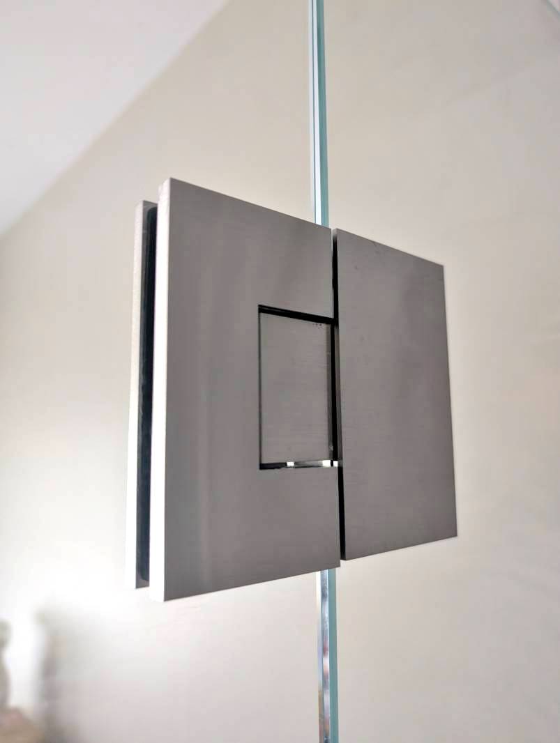 brushed-nickel-concealed-screw-hinge-close-up Close up of brushed nickel shower screen hinge