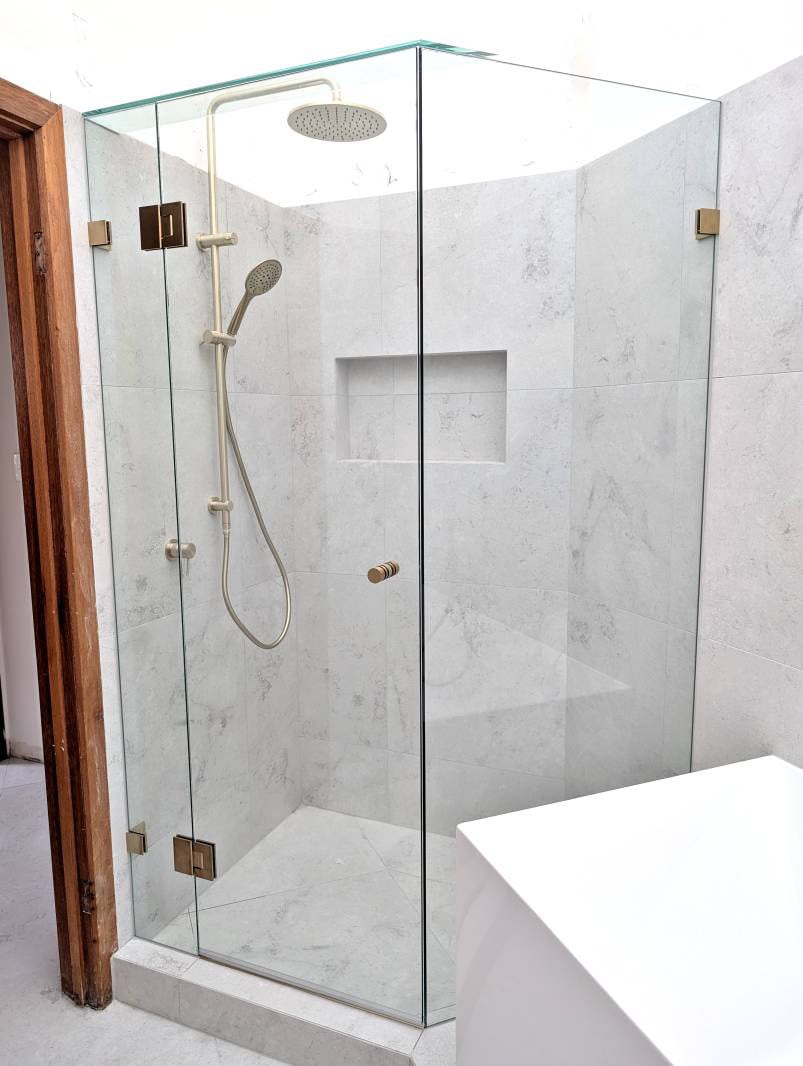 Diamond shape shower screen with brushed gold hardware