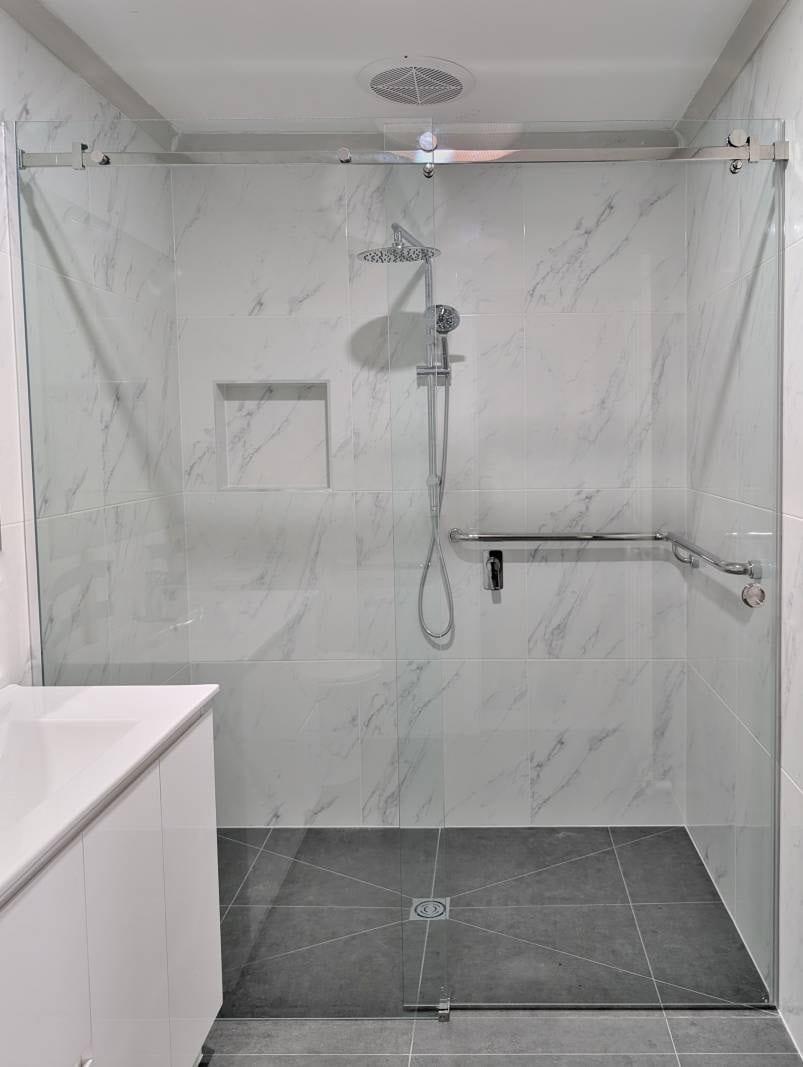 Full width sliding shower screen with wide door for wheel chair access