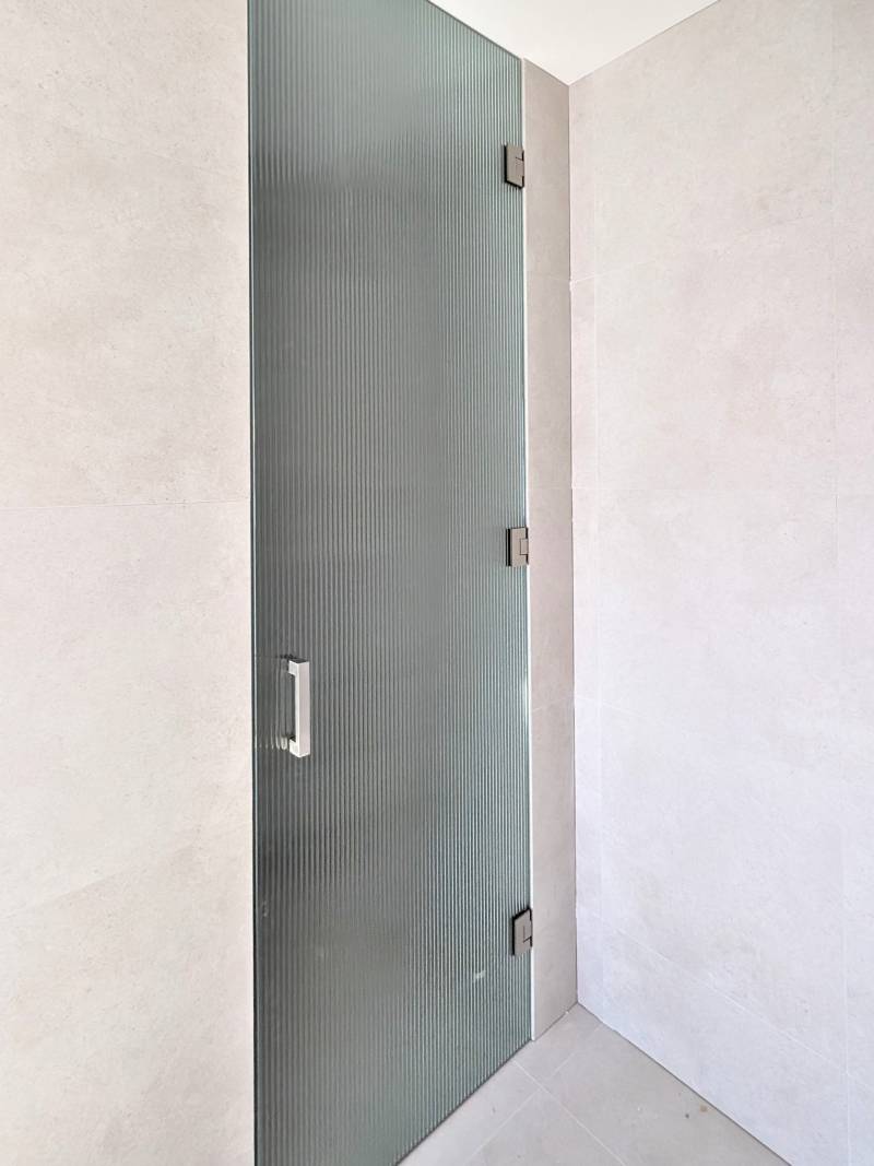 Full height full width fluted glass shower screen door