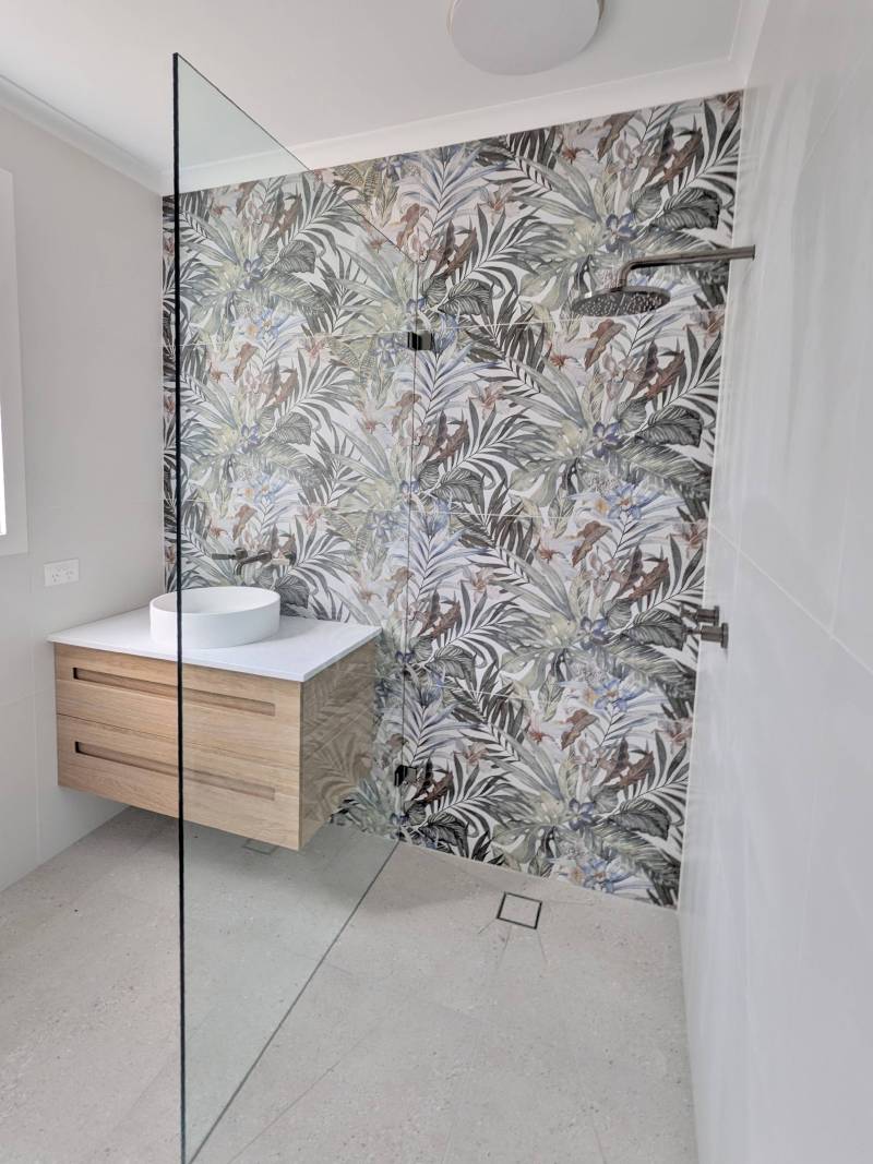 Walk in shower with a feature wall